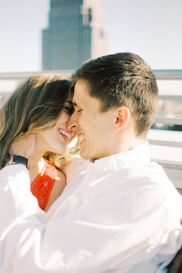 Couple Smiling Closely | Spring Engagement Photos in the City - ItsRiss Life